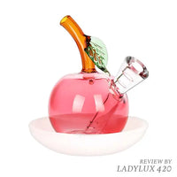 Astounding Apple on a Dish glass bubbler pipe for smooth, flavorful hits - left
