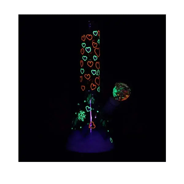 Glow-in-the-dark Heart Blossom 10" beaker bong with pink floral design on clear glass - night