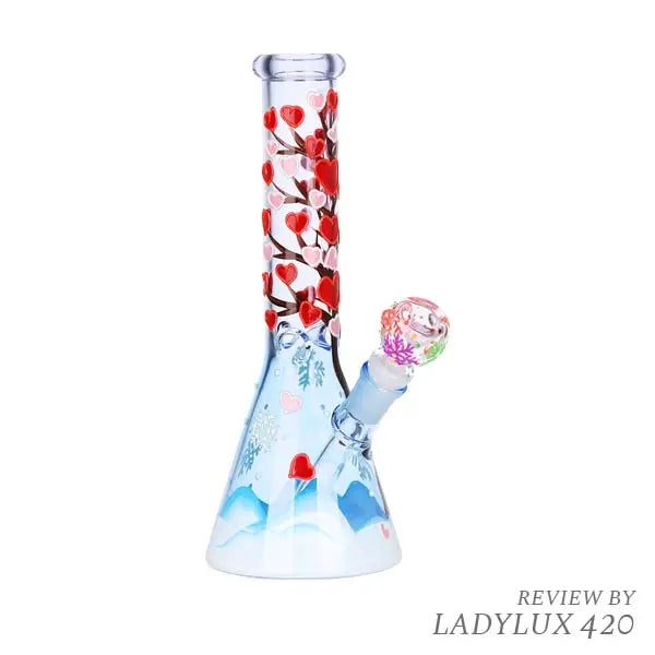 Glow-in-the-dark Heart Blossom 10" beaker bong with pink floral design on clear glass