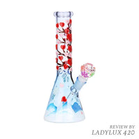 Glow-in-the-dark Heart Blossom 10" beaker bong with pink floral design on clear glass