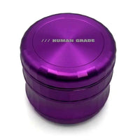 Human Grade 2.5" 4-Piece Aluminium Grinder – Durable Metal Herb Mill for Smooth Grinding - purple hero